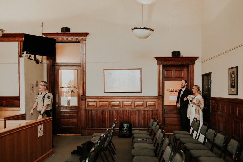 Bride's brother walking her down the aisle at the Jefferson County Courthouse. 