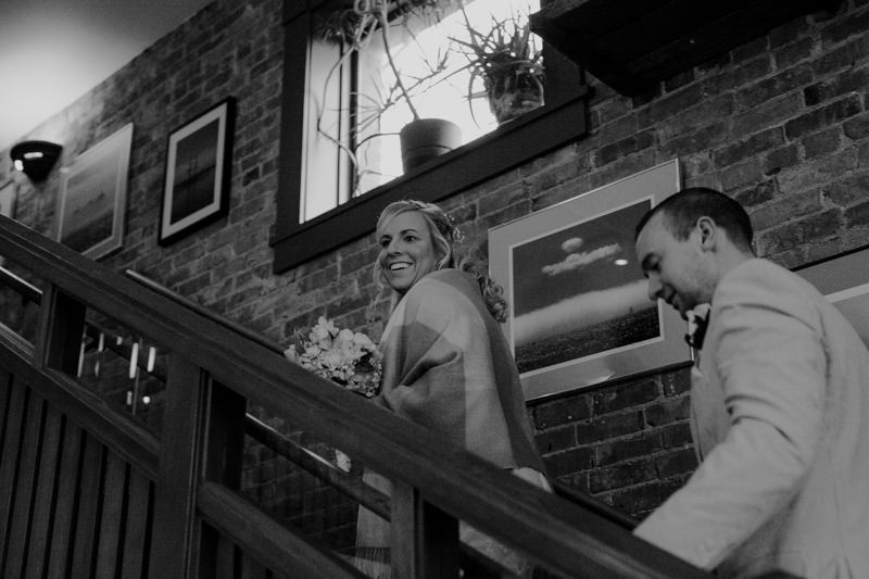 Bride and groom enter Silverwater Cafe in Port Townsend, for a small elopement reception. 