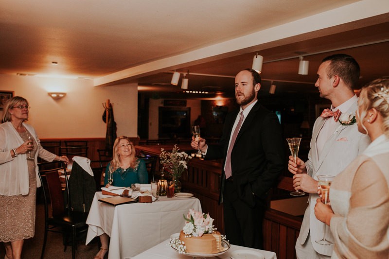 Bride's brother gives a toast during their small elopement reception in Port Townsend. 