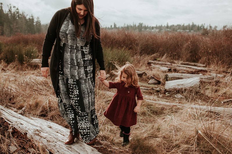 Lifestyle portrait session in Kitsap County, with mom wearing a maxi dress, holding daughter's hand. 