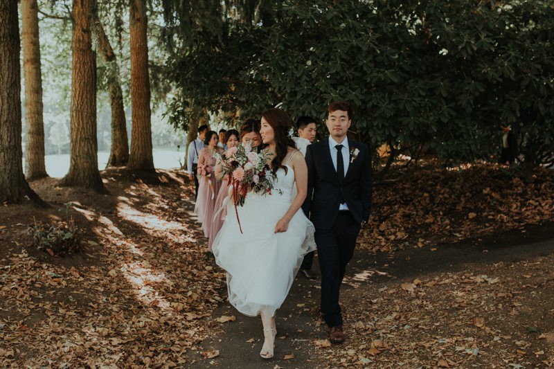 PNW wedding with bride in a tulle skirt dress and groom in a dark blue suit. 