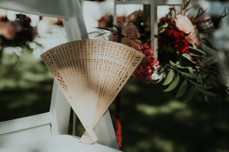 Simple wooden fan wedding favor for an early afternoon summer ceremony in Seattle, WA. 