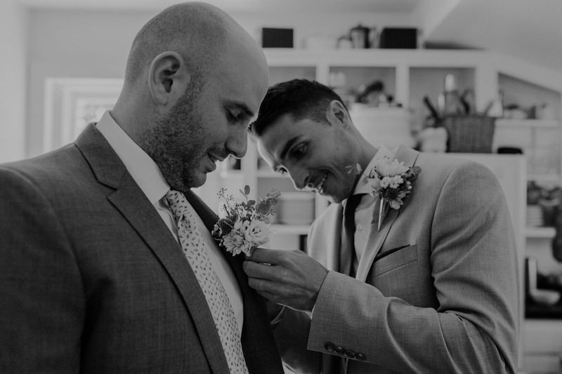 Groom and best man with handmade boutonnieres. 