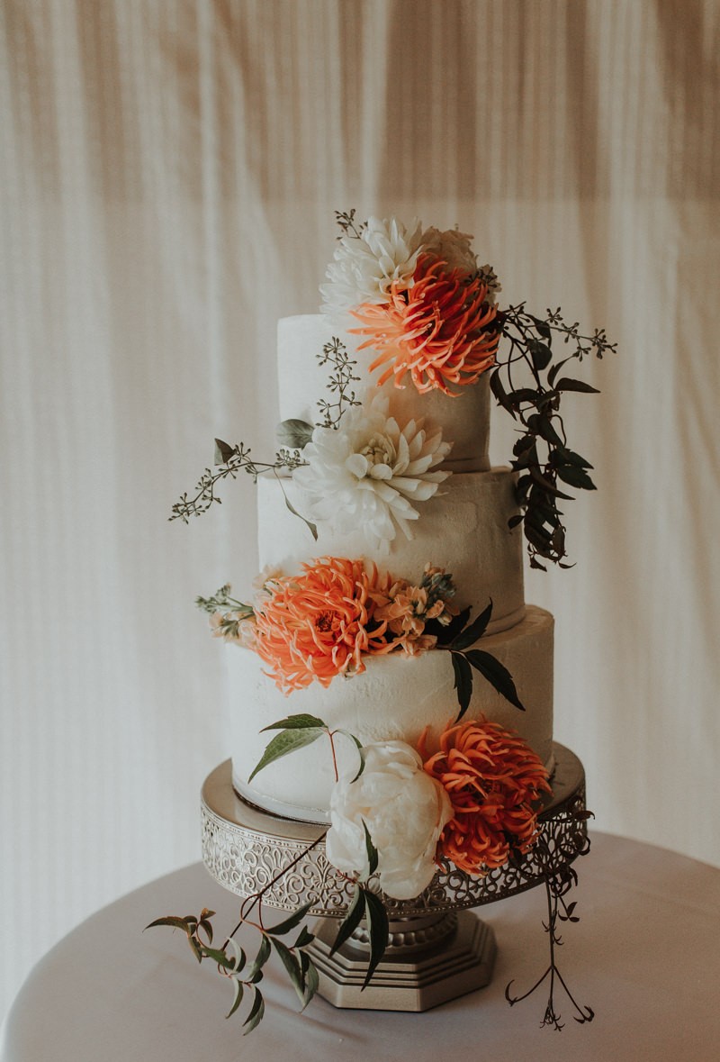 Three tiered wedding cake with fresh flowers | PNW wedding and elopement photographer Meghann Prouse | www.photomegs.com.