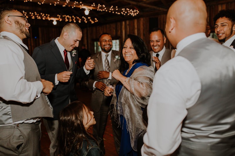 Groom dancing with his mom and brothers at Kitsap Memorial State Park | PNW wedding + elopement photographer Meghann Prouse | www.photomegs.com