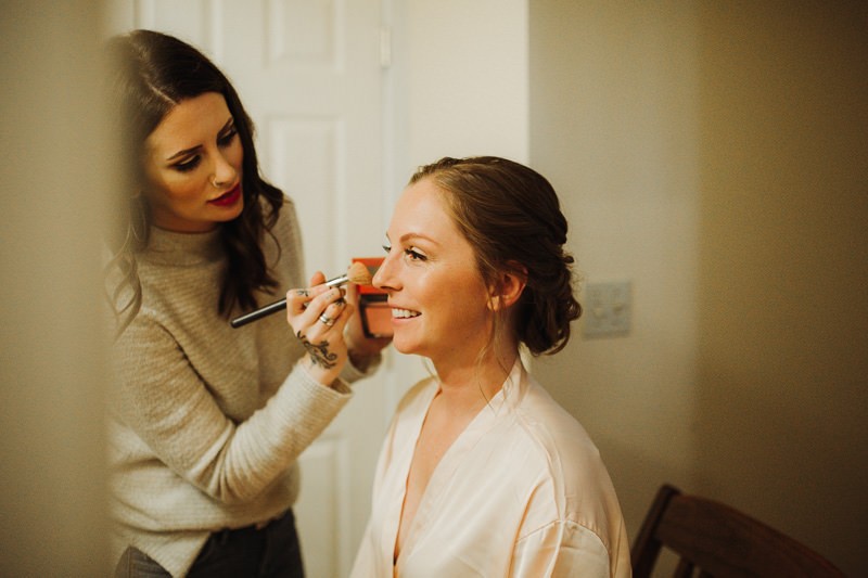 Bride getting ready at The Edgewater House wedding in Olalla, Washington | Kitsap County elopement + wedding photographer Meghann Prouse | www.photomegs.com
