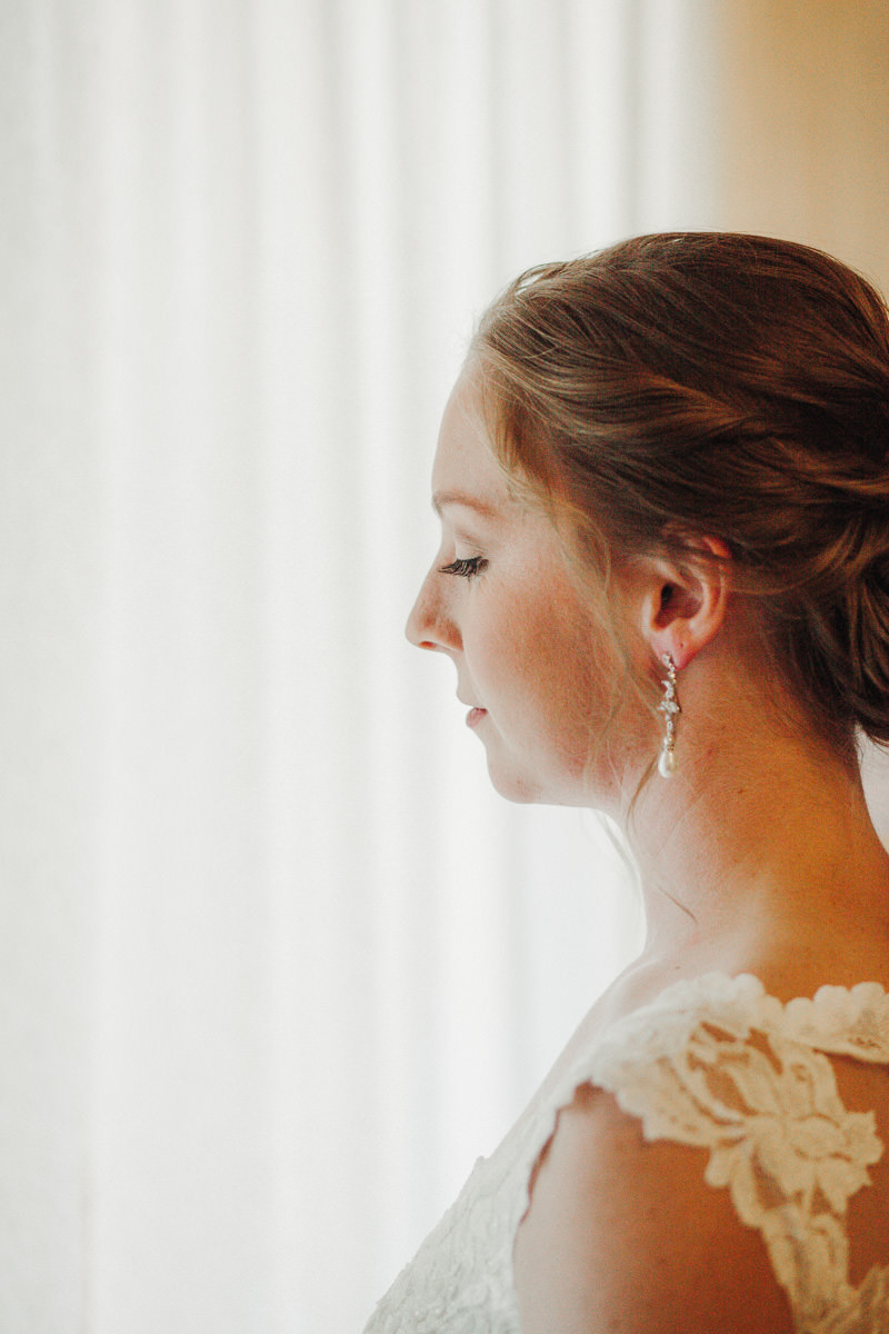 Bride with chignon updo at The Edgewater House | PNW wedding + elopement photographer Meghann Prouse | www.photomegs.com