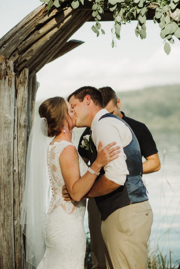 First kiss, beach wedding at The Edgewater House in Olalla, WA | Washington State wedding + elopement photographer Meghann Prouse | www.photomegs.com