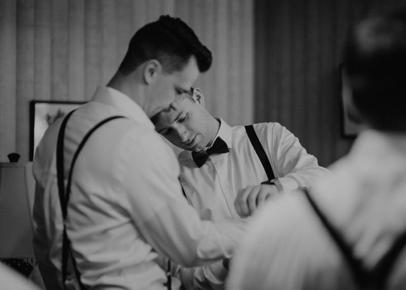 Groomsmen helping groom get ready | Northwest Trek wedding day | Seattle wedding photographer
