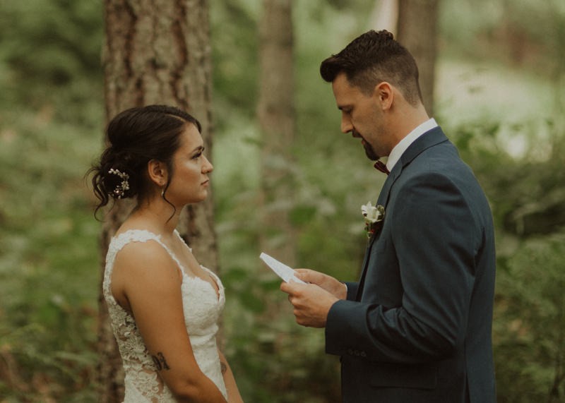 Groom reading personal vows to bride during first look | Northwest Trek wedding day | Seattle wedding photographer
