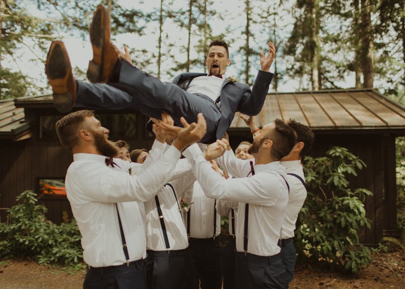 Groomsmen throwing groom in the air | Northwest Trek wedding day | Seattle wedding photographer
