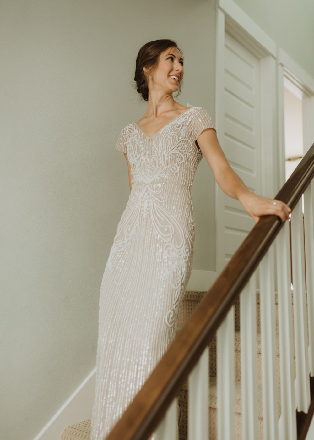 Bride in a vintage beaded wedding dress from BHLDN