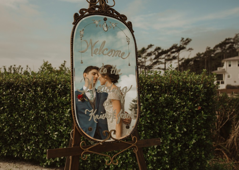 Vintage mirror welcome sign for beach wedding. 