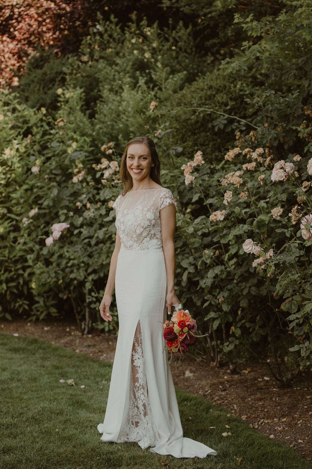 Bride wearing a modern floral-print lace wedding dress. 