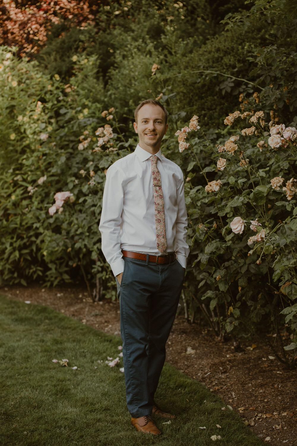 Small wedding ceremony in Seattle, with groom in a modern pink floral tie. 