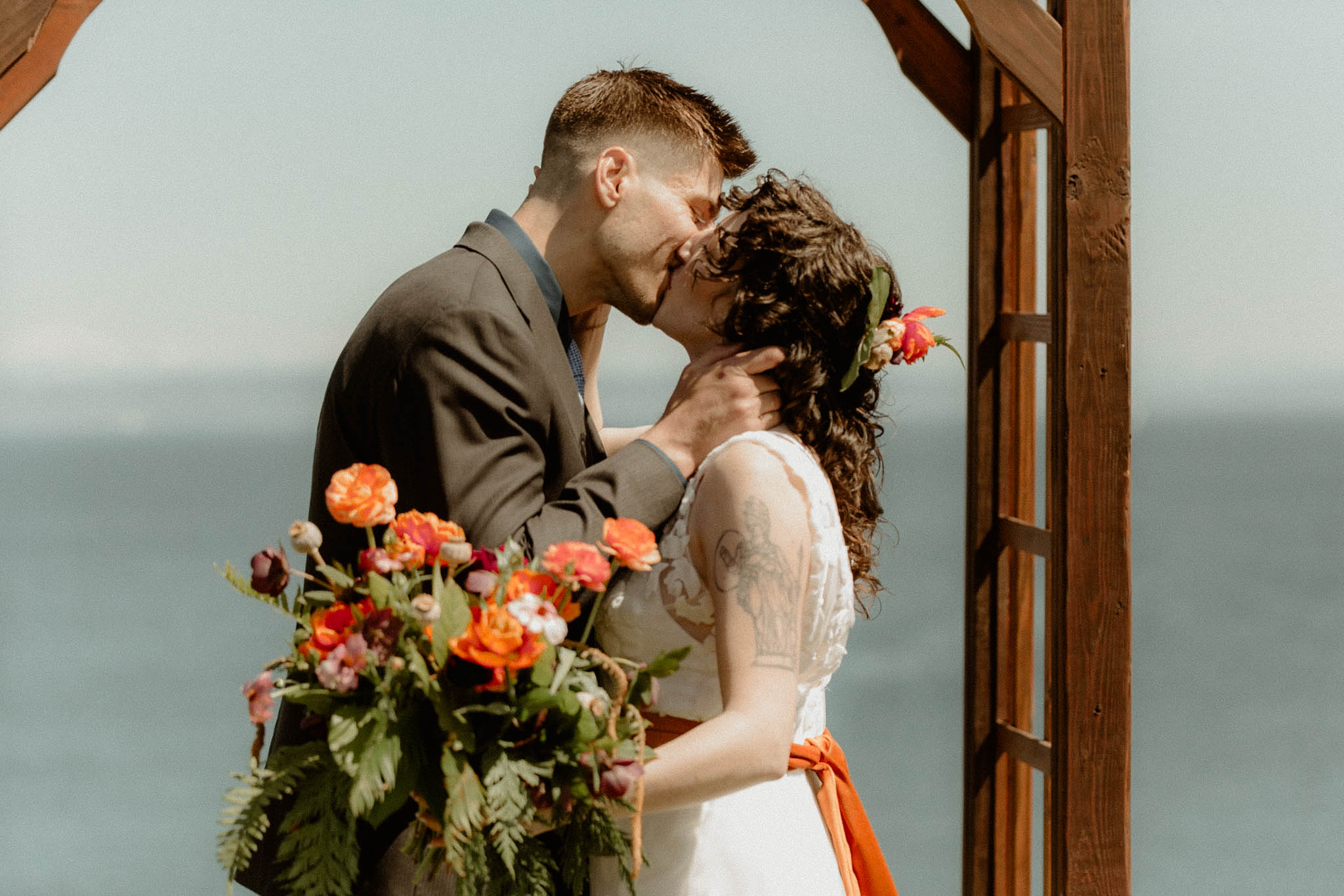 spring elopement ceremony with bright floral bouquet