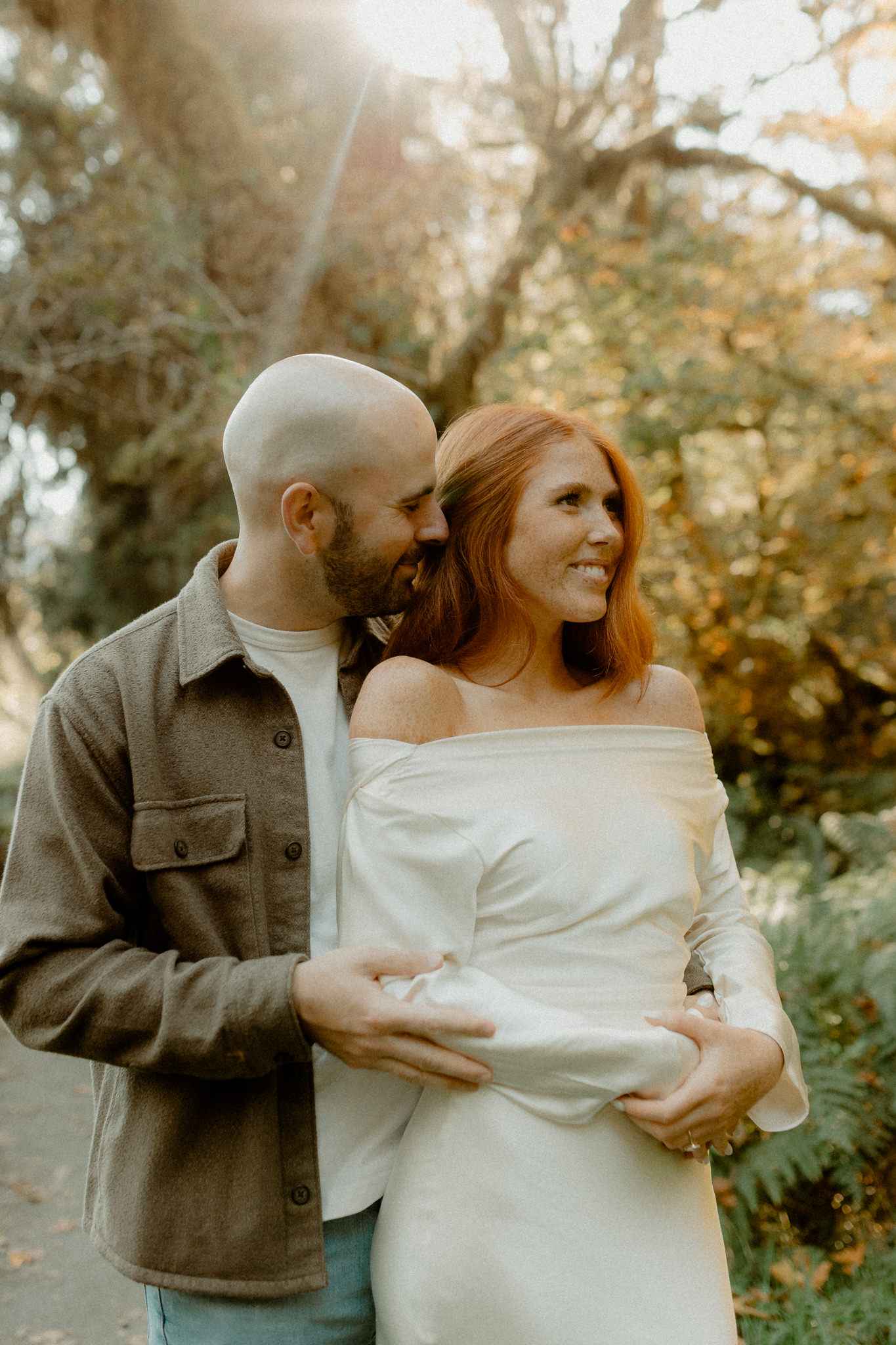 PNW engagement session with redheaded bride in an off-the-shoulder white satin dress. 