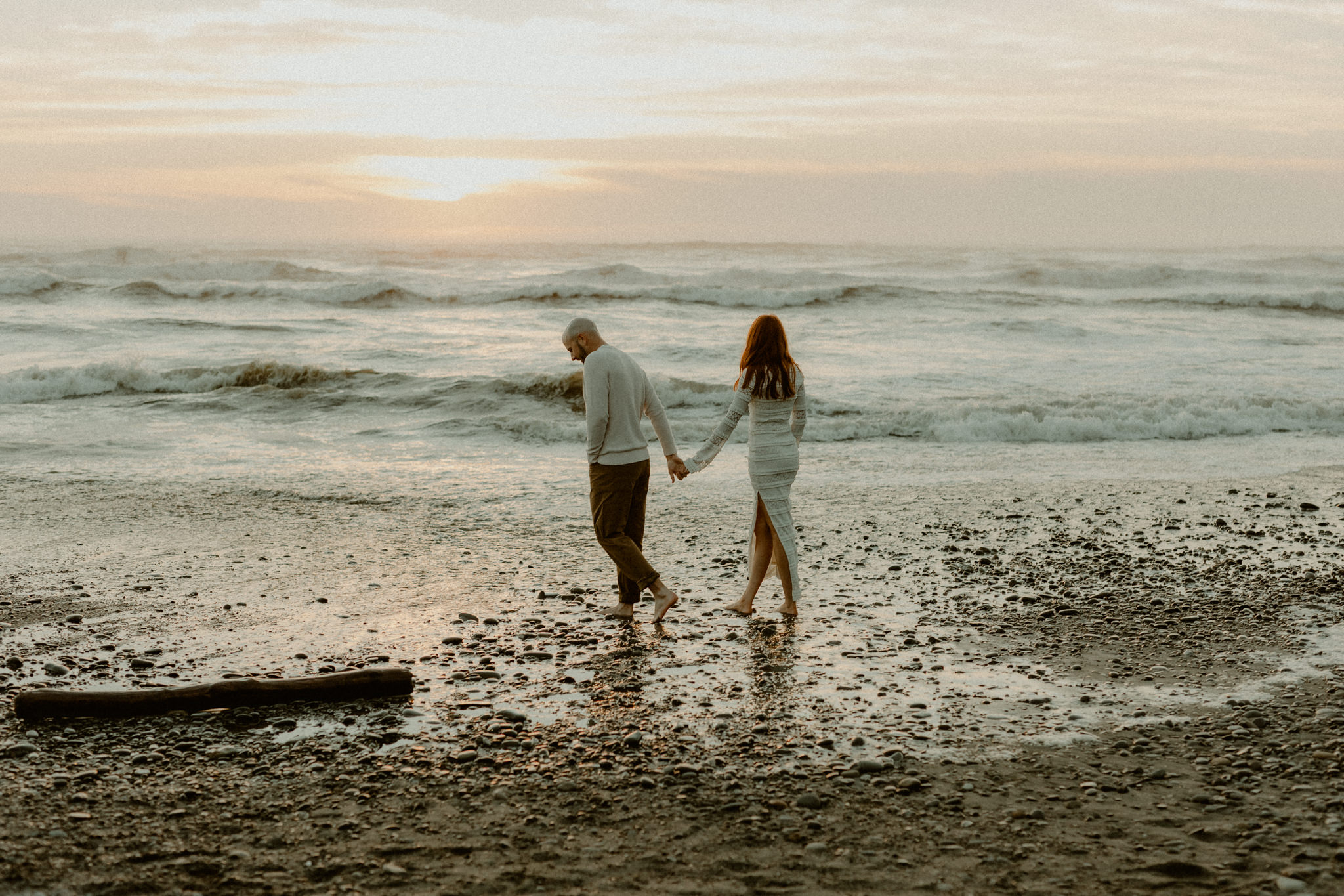 Couple exploring Olympic National Park coastline during sunset