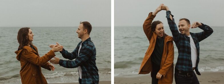 Fun, free-spirited rainy engagement photos on the beach in Kitsap County. 